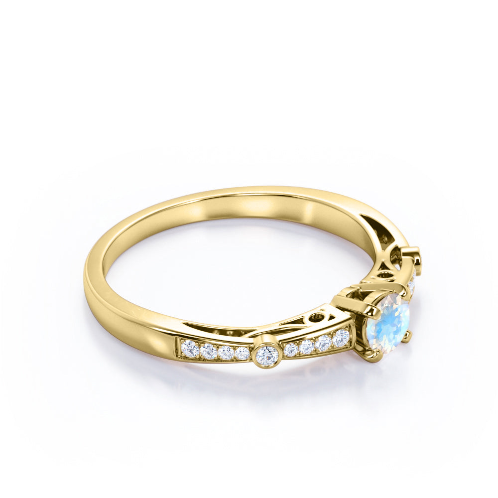 Basket set 1.25 carat Round cut Blue Moonstone and Diamond tapered shank engagement ring in Yellow gold