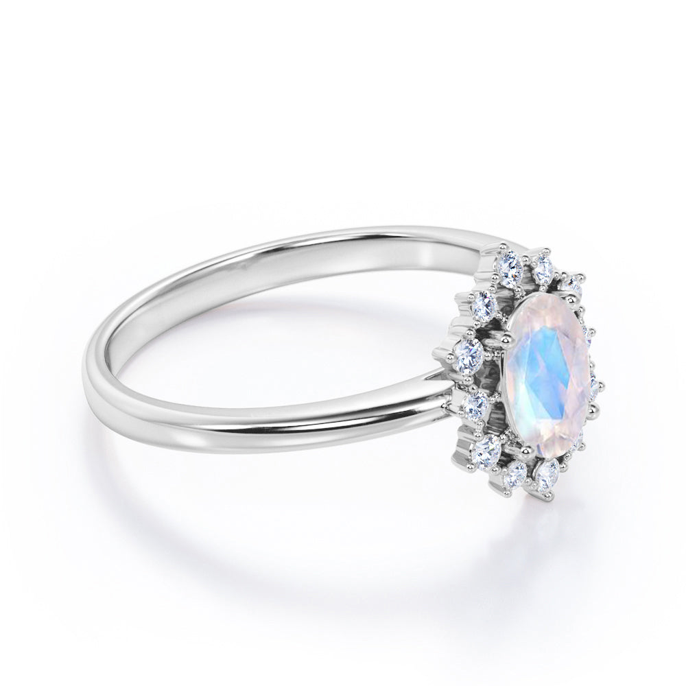 Snowflake inspired 1.25 carat Oval cut Moonstone and diamond unique halo engagement ring in Black gold