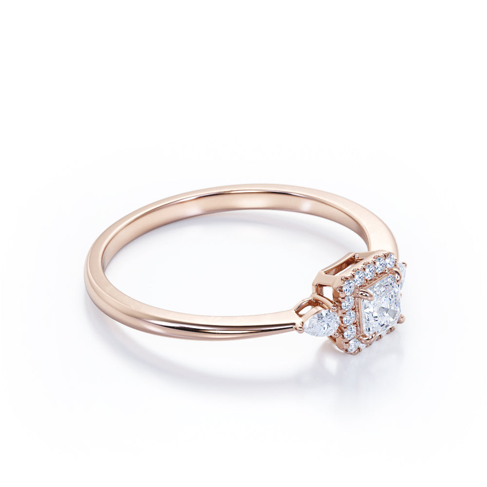 Tapered triple stone 0.7 carat Round cut Moissanite and diamond halo engagement ring in White gold