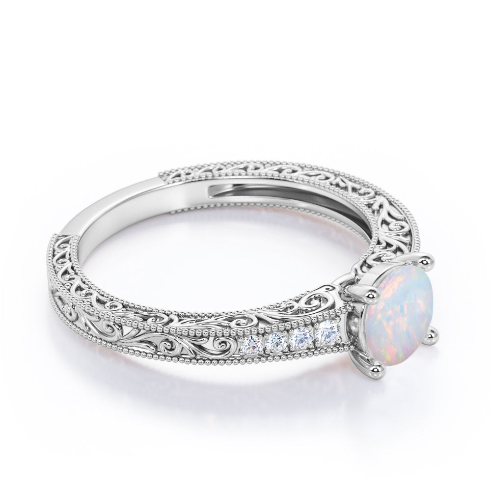 Vintage Edwardian style 1.1 carat Round cut Australian Boulder Opal and diamond filigree and milgrain engagement ring in White gold