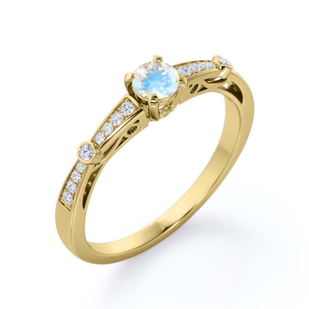 Basket set 1.25 carat Round cut Blue Moonstone and Diamond tapered shank engagement ring in Yellow gold