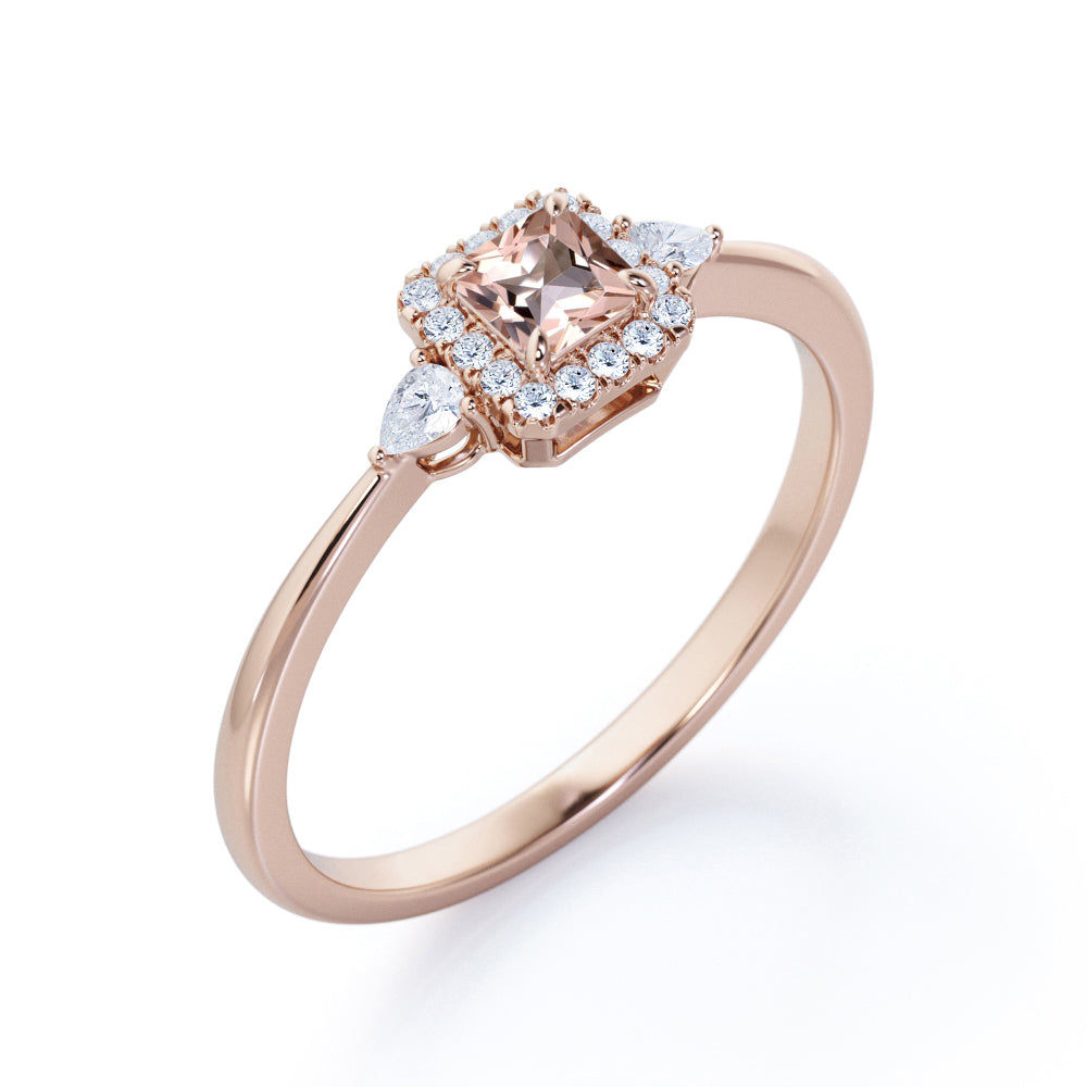 Exquisite three stone 0.75 carat Princess cut Peach Pink Morganite and diamond tapered style anniversary ring in Yellow gold