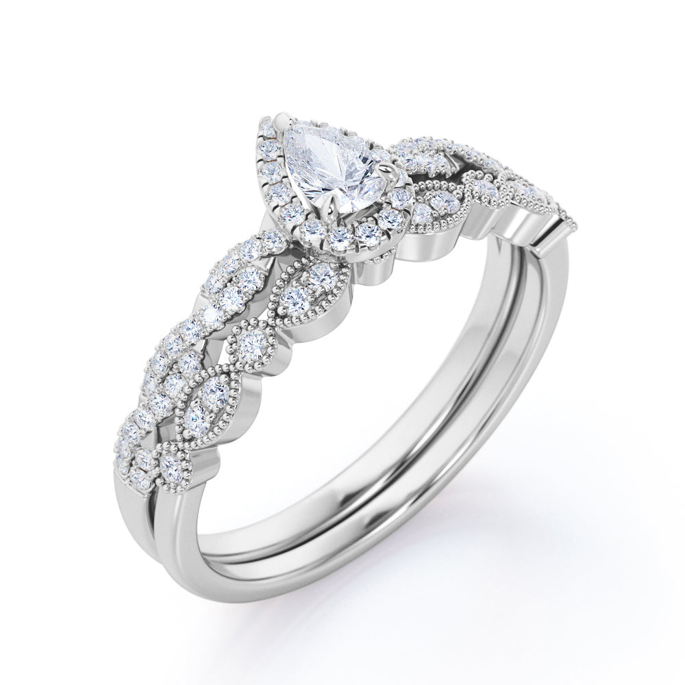 Vintage infinity 1.25 carat Pear shaped Moissanite and diamond milgrain and halo Bridal set in Rose gold