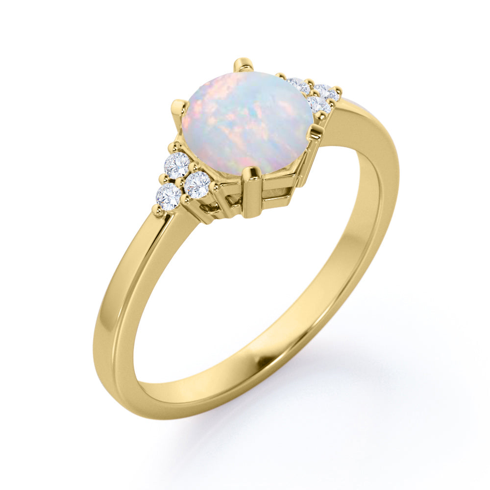 Unique Tapered style 1 carat Round cut Opal and diamond 7 stone engagement ring in Yellow gold