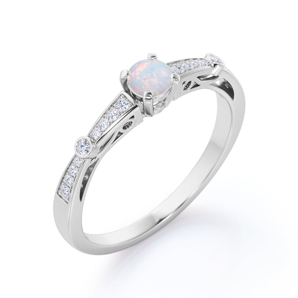 Artistic 0.66 carat Round cut Natural Ethiopian Opal and diamond art deco style engagement ring in Yellow gold