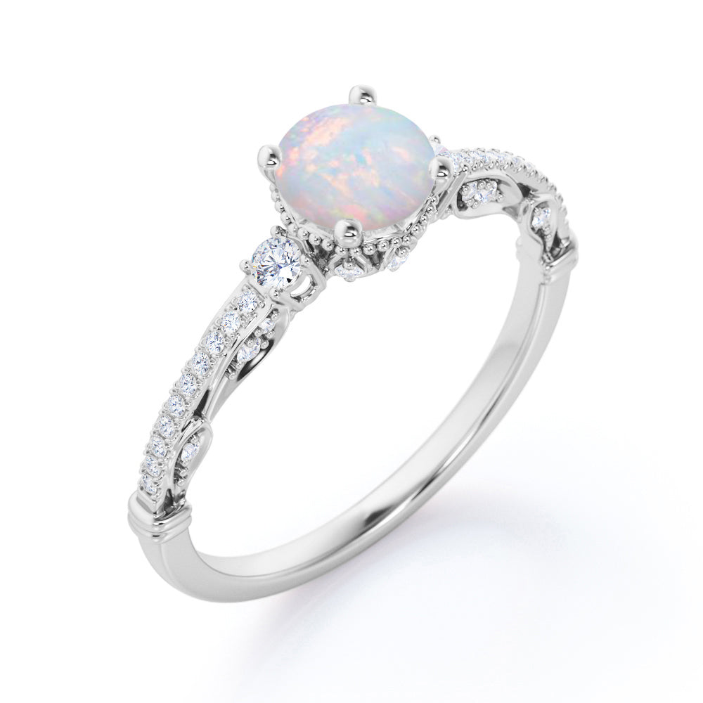Artistic 3 stone 1.30 carat Round cut Ethiopian Opal and diamond antique art deco engagement ring in Black gold