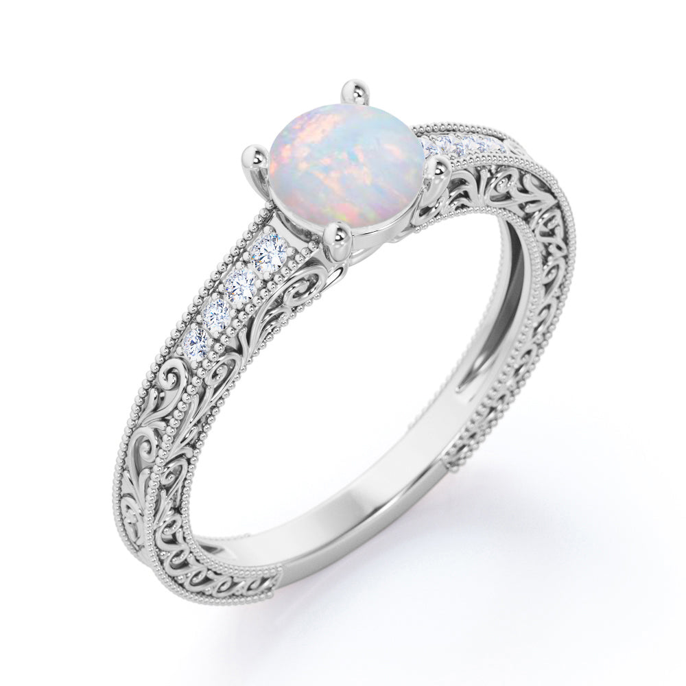Vintage Edwardian style 1.1 carat Round cut Australian Boulder Opal and diamond filigree and milgrain engagement ring in White gold