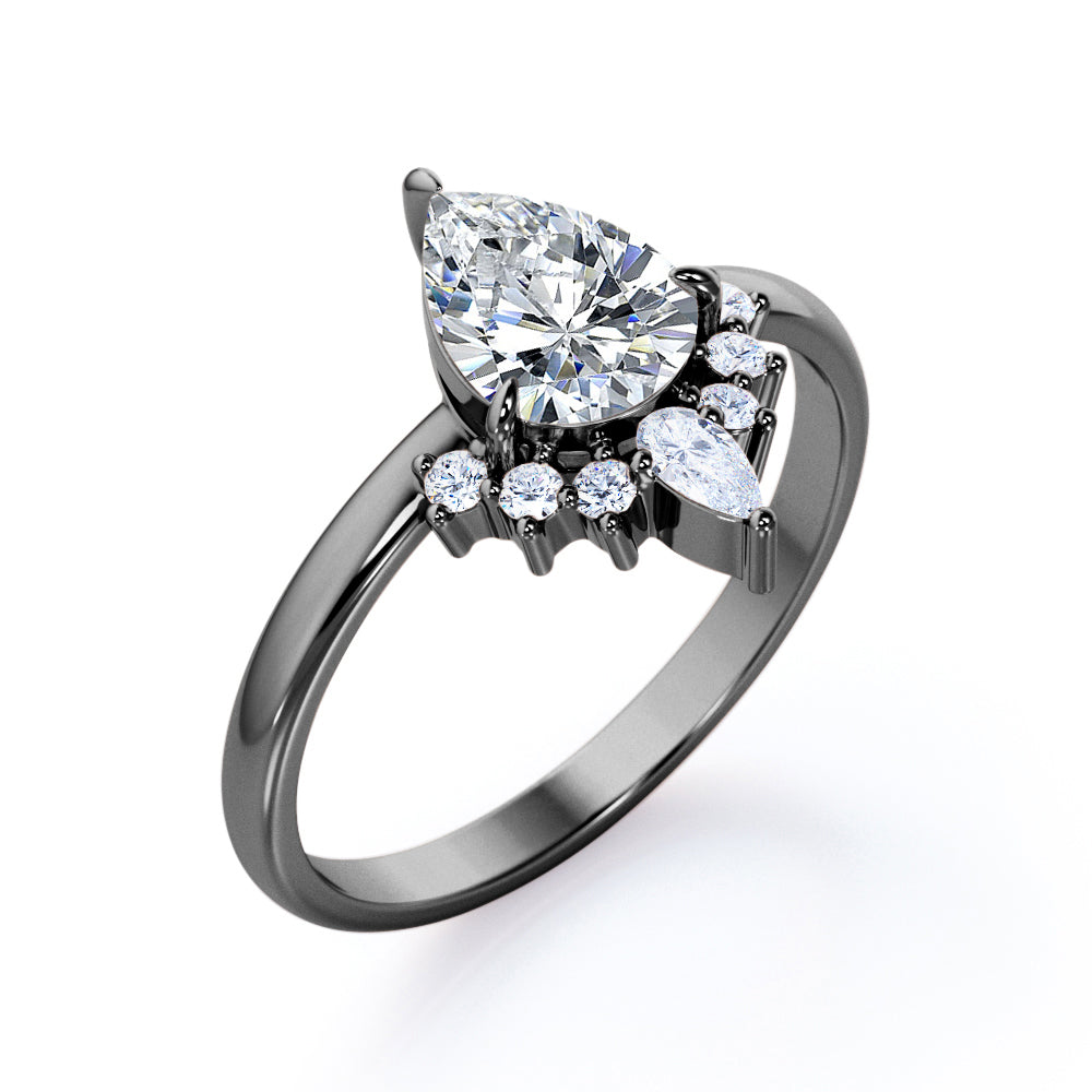 Chevron crown inspired 1.1 carat Pear shaped Moissanite and diamond engagement ring in Rose gold