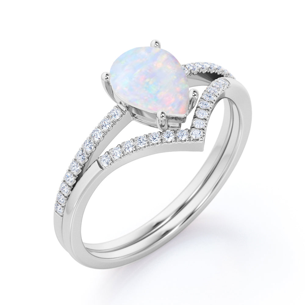 Chevron contour 1.35 carat Pear shaped Ethiopian Opal and diamond-pave set-4 prong Bridal set for women in Black gold