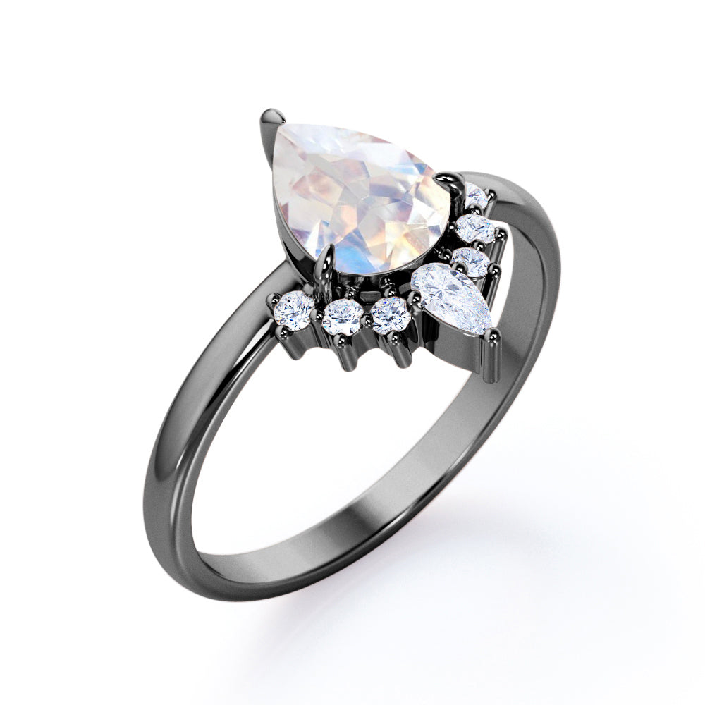 Crown Tiara inspired 1.2 carat Pear cut Rainbow Moonstone and diamond prong style engagement ring in Rose gold
