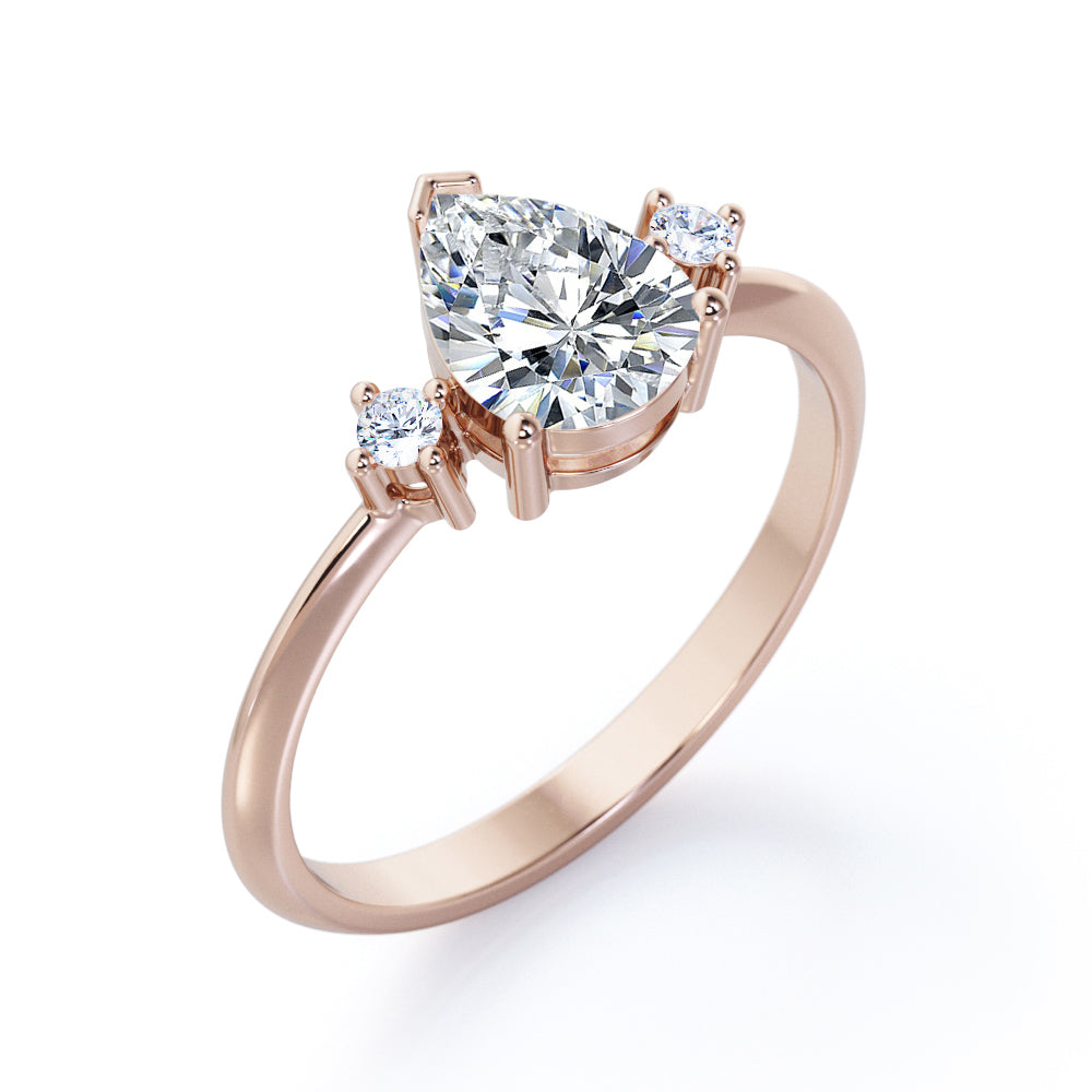 Classic Trinity 1 carat Pear shaped Moissanite and diamond-prong setting-pinched shank engagement ring in White gold