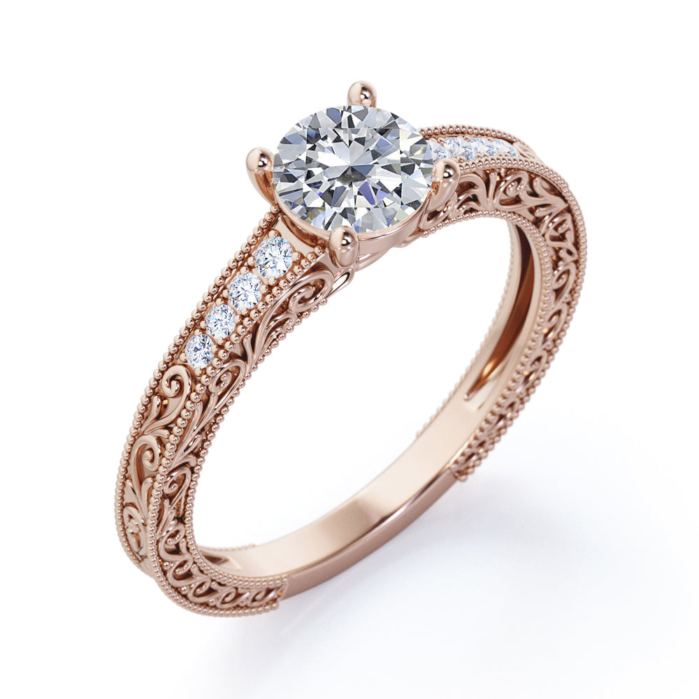 Artistic filigree 1.1 carat Moissanite and diamond low-basket setting engagement ring in White gold