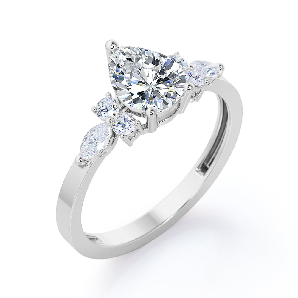 Antique 7 stone 1.1 carat Pear Shaped Moissanite and diamond 3 prong engagement ring in Rose gold