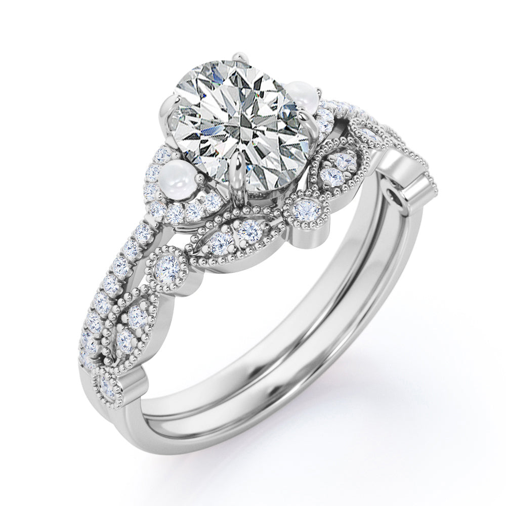 Artistic art deco inspired 1.5 carat Oval shaped Moissanite, diamonds and pearls milgrain wedding ring set for women in Black gold