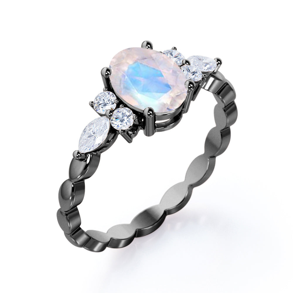 Scalloped Rope Design 1.15 carat Oval cut Moonstone and diamond 7 stone engagement ring in White gold