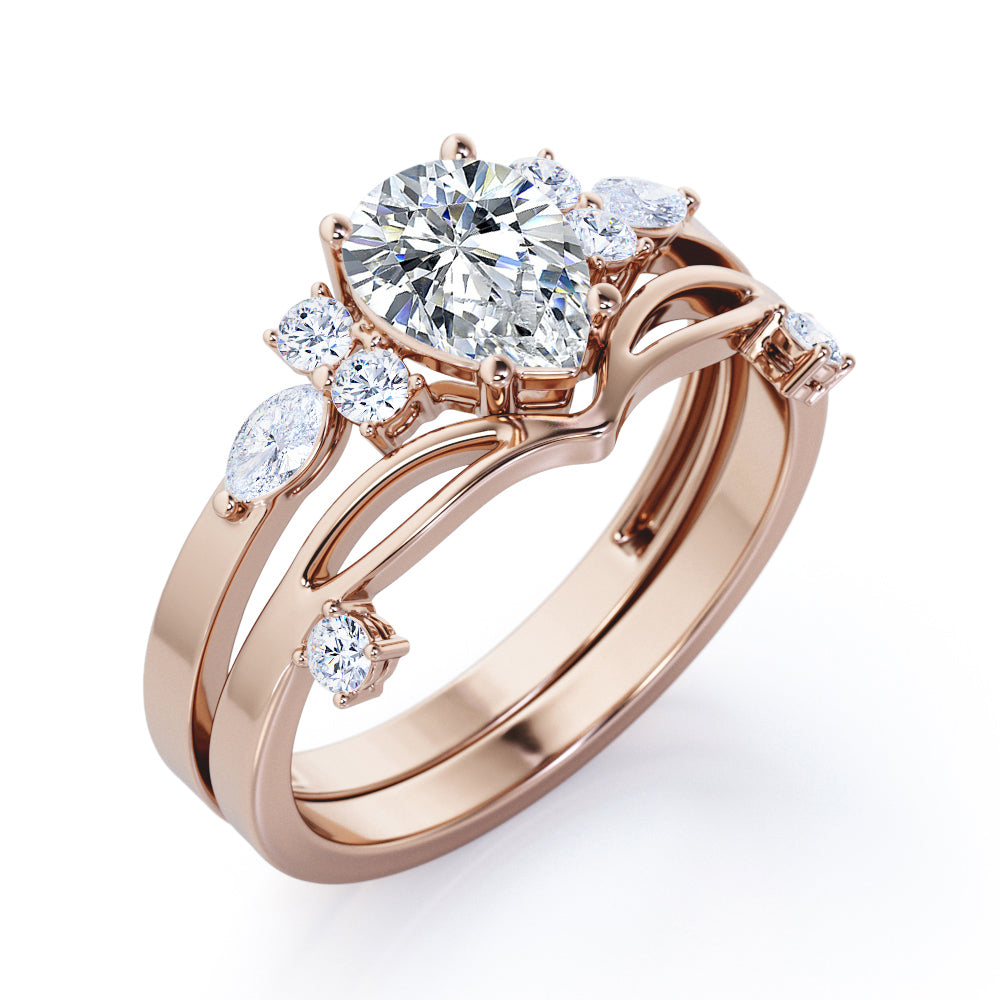 Split shank Chevron 1.2 carat tear drop shaped Moissanite and diamond art deco style engagement ring in Black gold