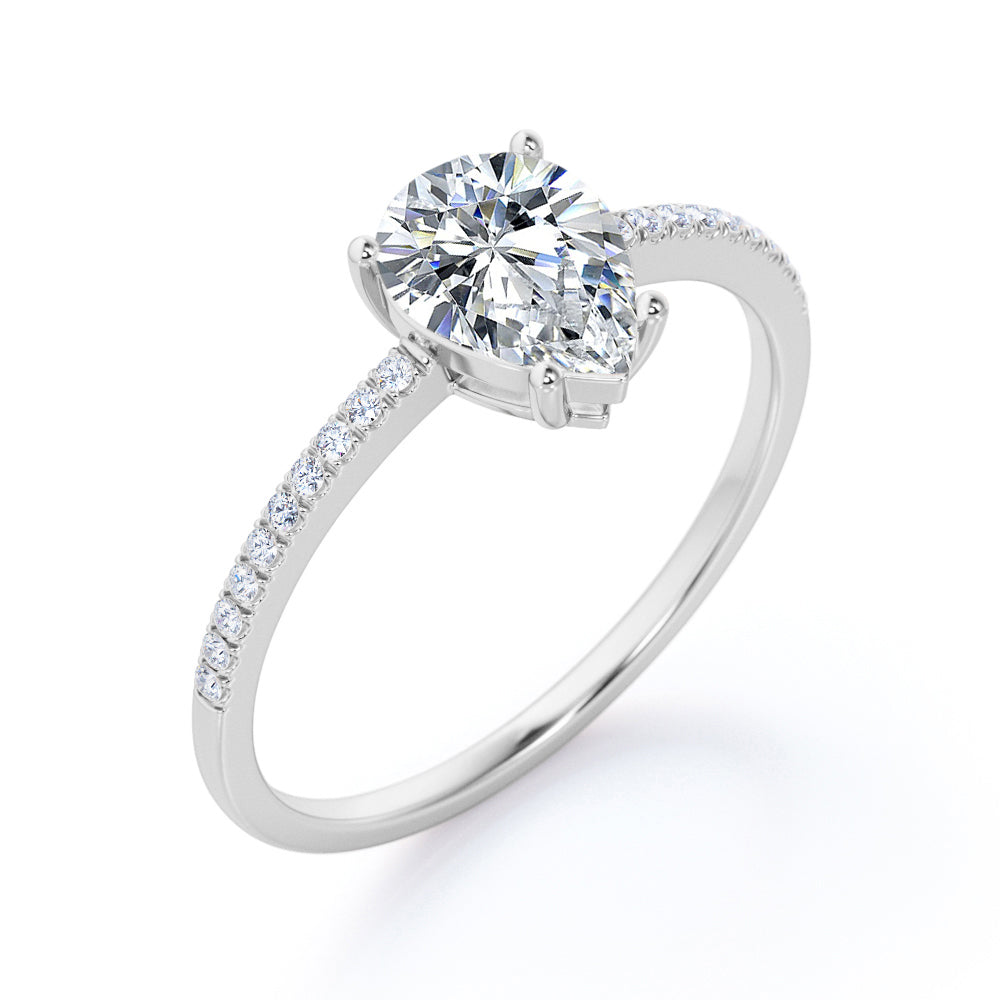 Elegant 1.2 carat Pear shaped Moissanite and diamond vintage prong engagement ring in Black gold