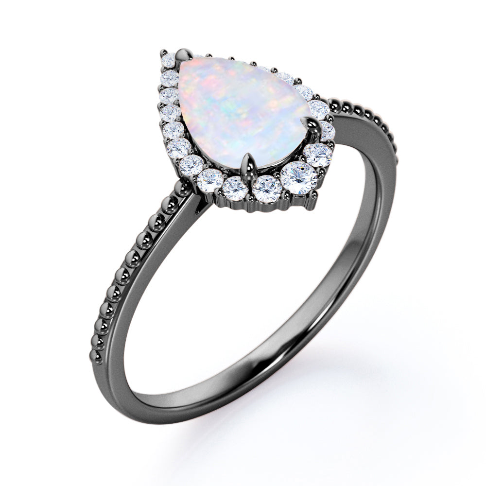 Antique Milgrain 1.2 carat Tear drop shape Fiery Opal and diamond halo engagement ring in White gold