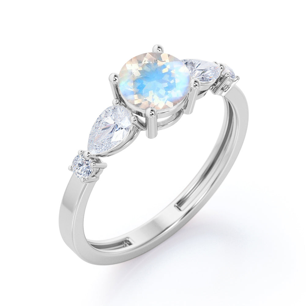 Modern 1.15 carat Round cut Blue Moonstone and diamond marquise 5 stone engagement ring in Rose gold