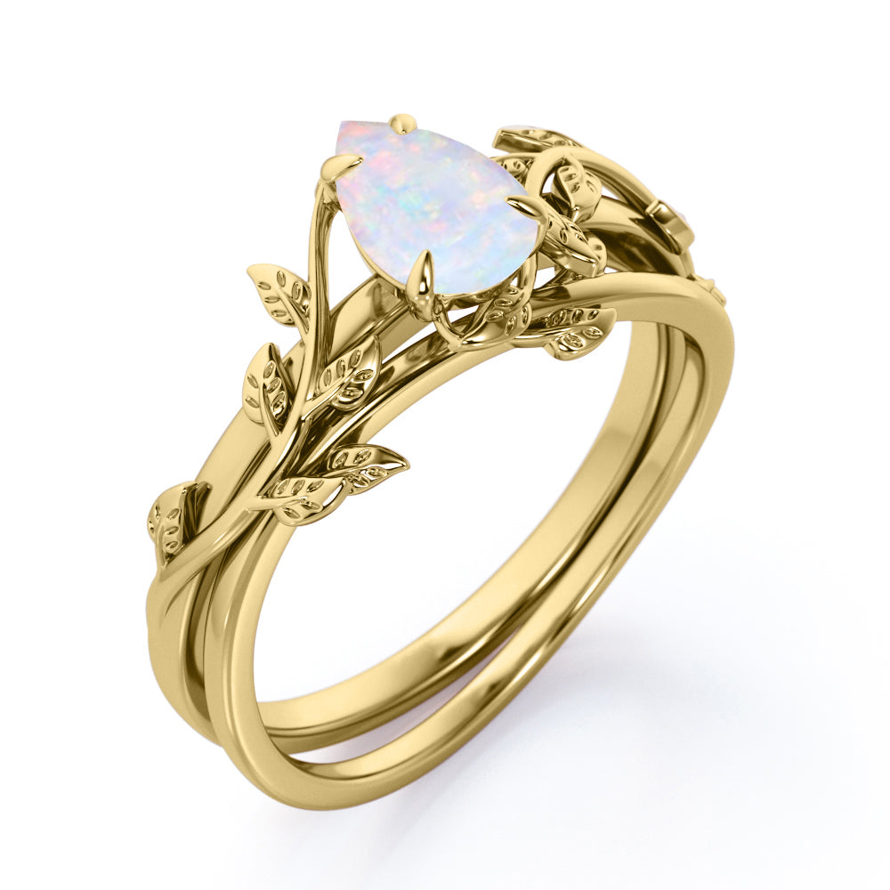 Eccentric 1 carat Pear cut Ethiopian Opal vine-leaf inspired Bridal ring set for women in White gold