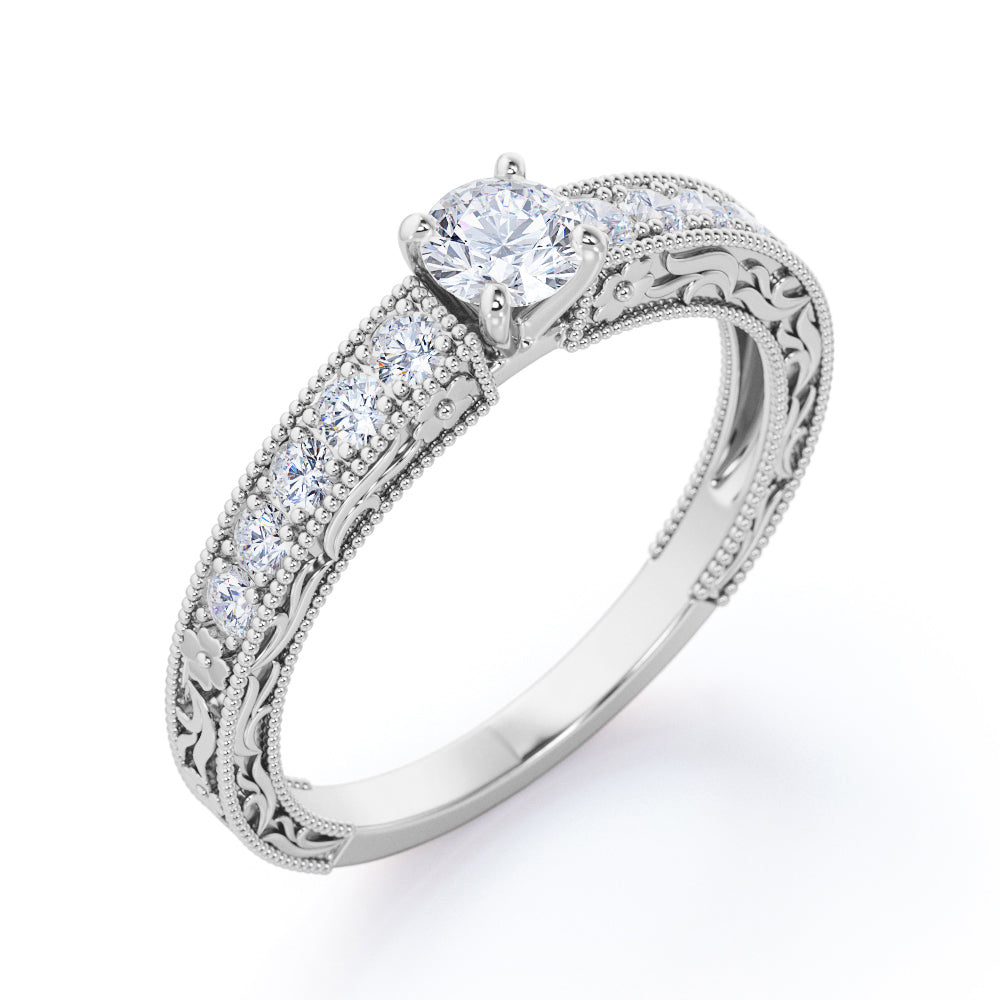 Victorian style 0.6 carat Round cut Moissanite and diamond Milgrain and filigree engagement ring in Rose gold