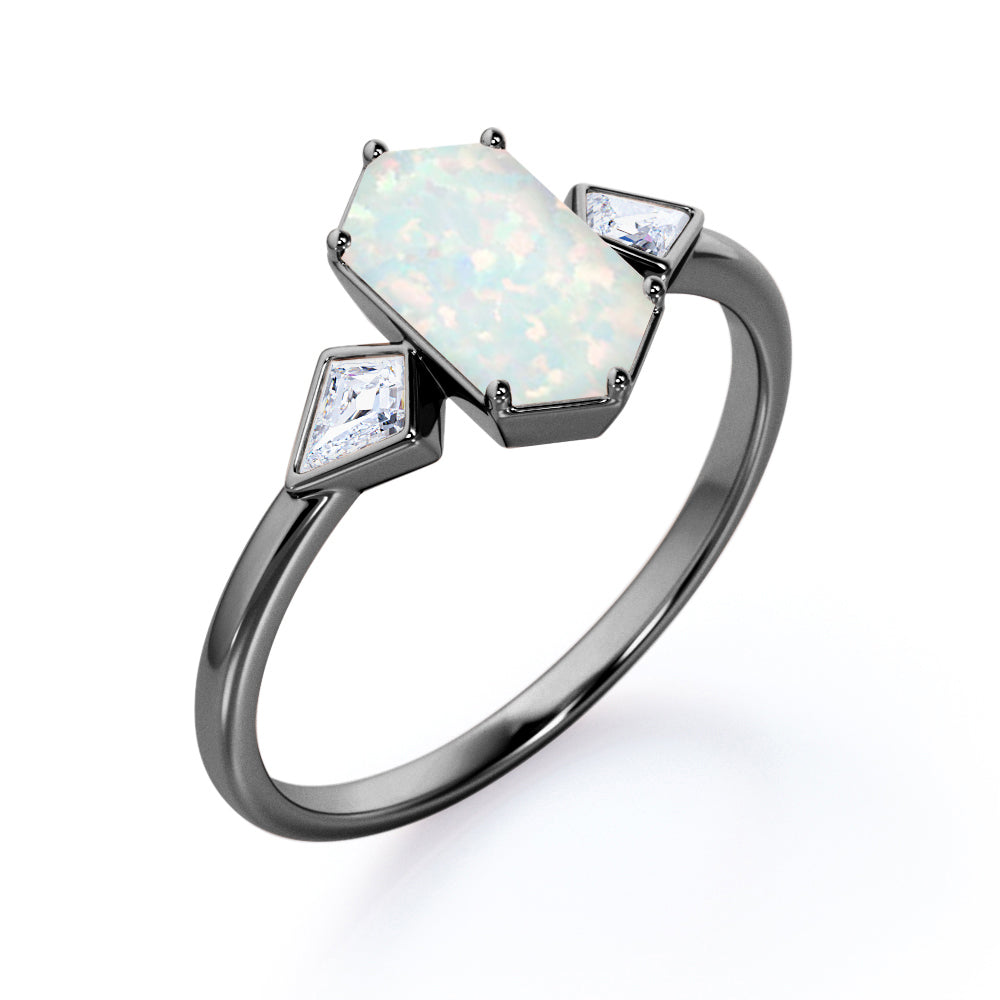 Elongated 1.10 carat Hexagonal Opal and marquise diamond bezel set engagement ring in Black gold