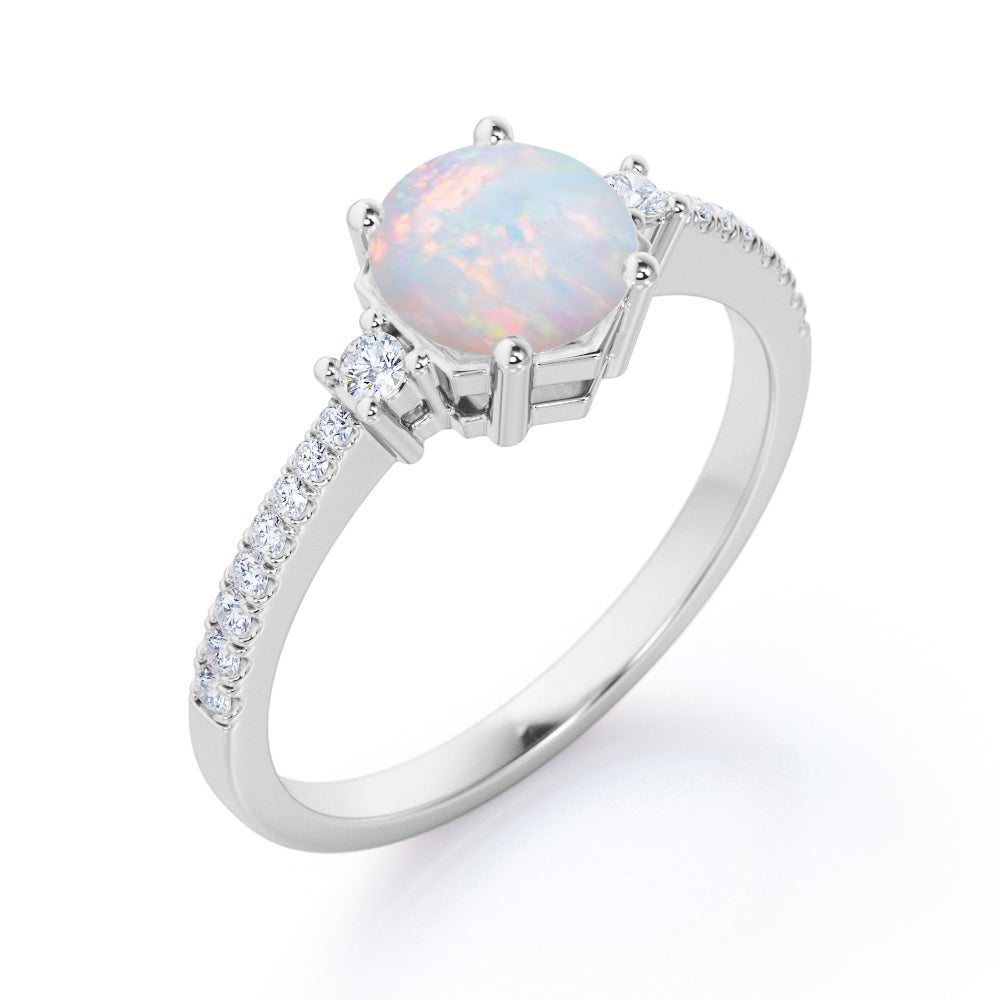 Contemporary 3 stone 1.2 carat Round cut Ethiopian Opal and diamond basket setting low basket setting engagement ring in White gold