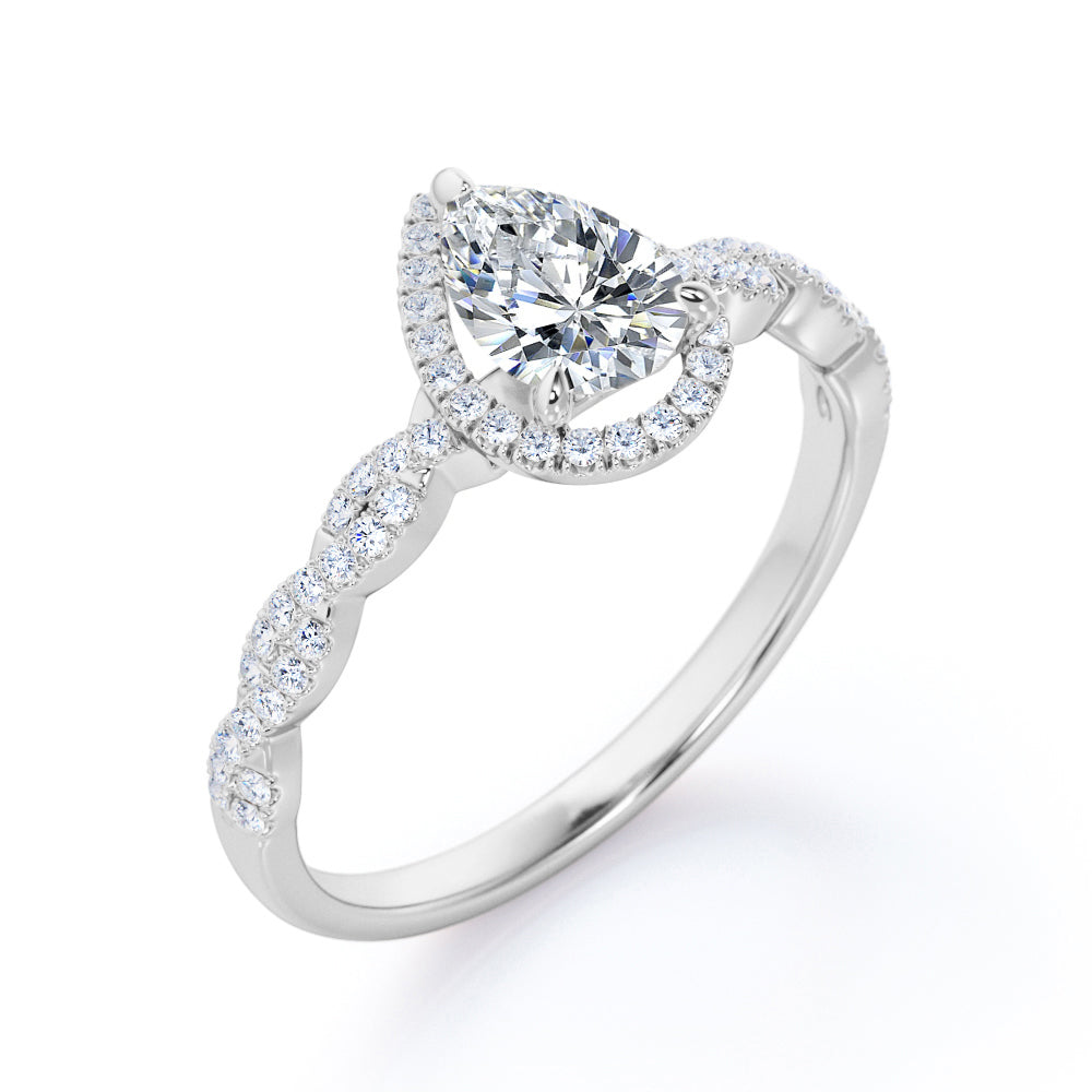 Twisted rope style 1.5 carat Pear cut Moissanite and diamond infinity halo engagement ring in Rose gold
