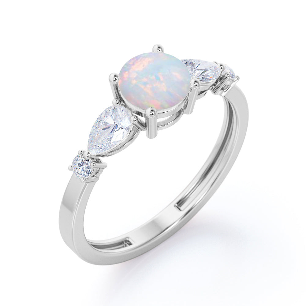 Eccentric 1.25 carat Round cut Ethiopian Opal and marquise and dot diamond engagement ring in Rose gold