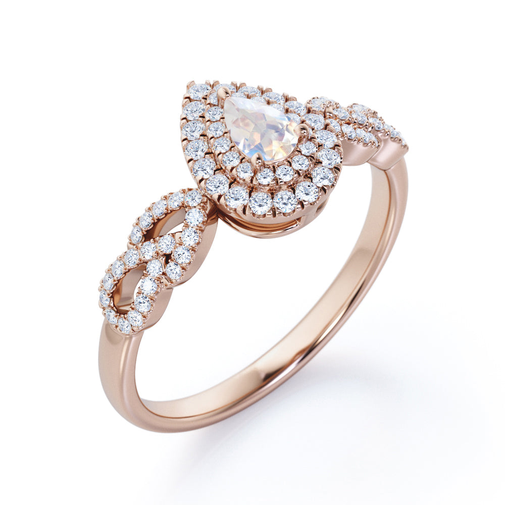 Intertwined 1.7 carat Pear shaped Blue Moonstone and diamond twisted infinity halo engagement ring in White gold