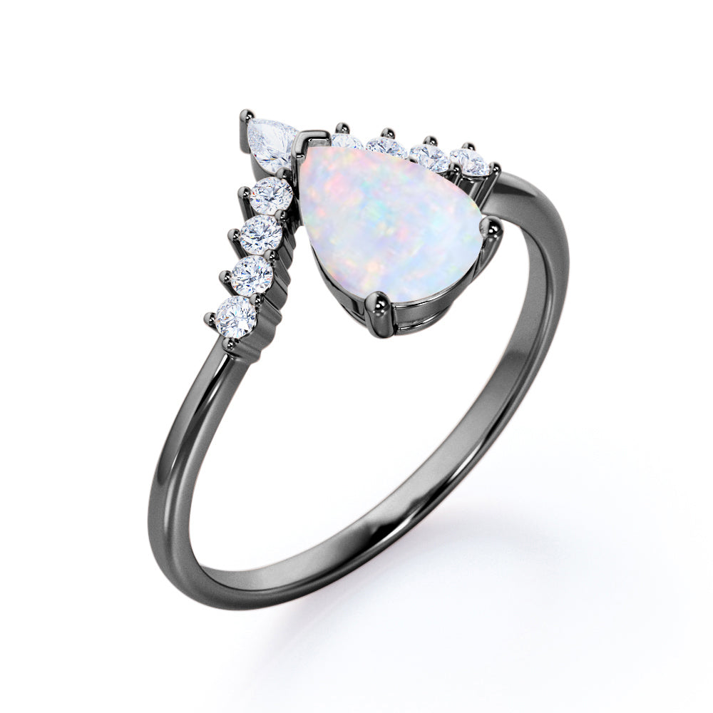 Elegant V-shaped 1.15 carat Pear cut Ethiopian Opal and diamond tiara style engagement ring in Rose gold