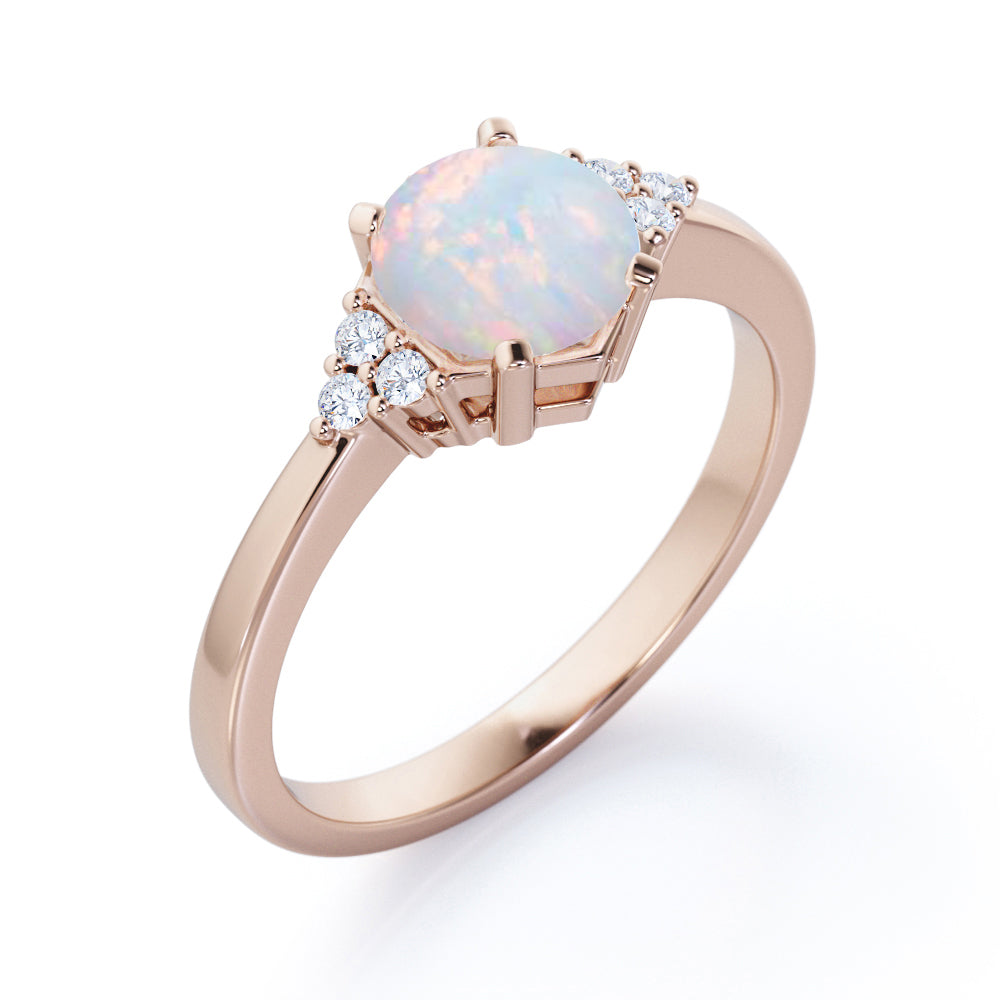 Unique Tapered style 1 carat Round cut Opal and diamond 7 stone engagement ring in Yellow gold