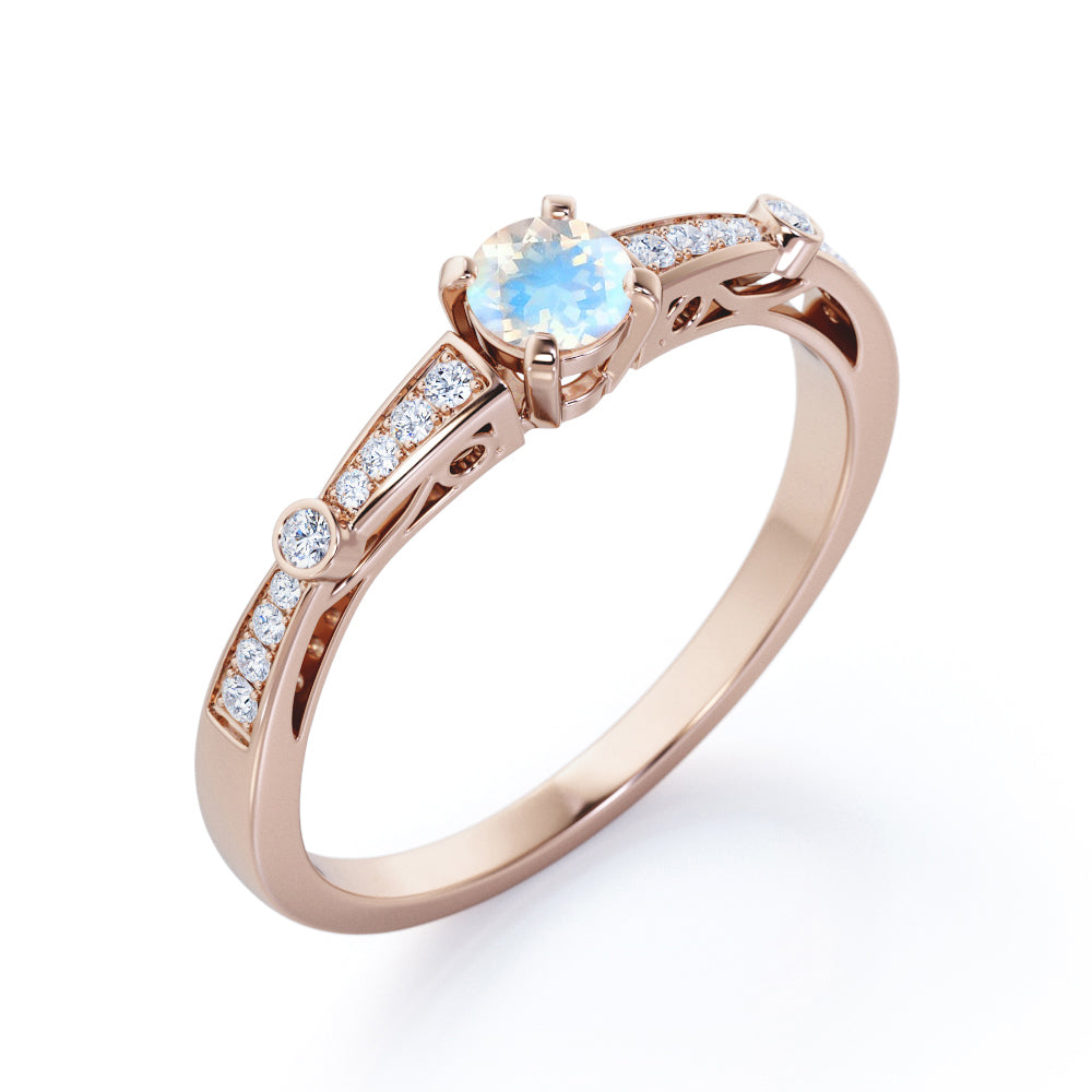 Basket set 1.25 carat Round cut Blue Moonstone and Diamond tapered shank engagement ring in Yellow gold