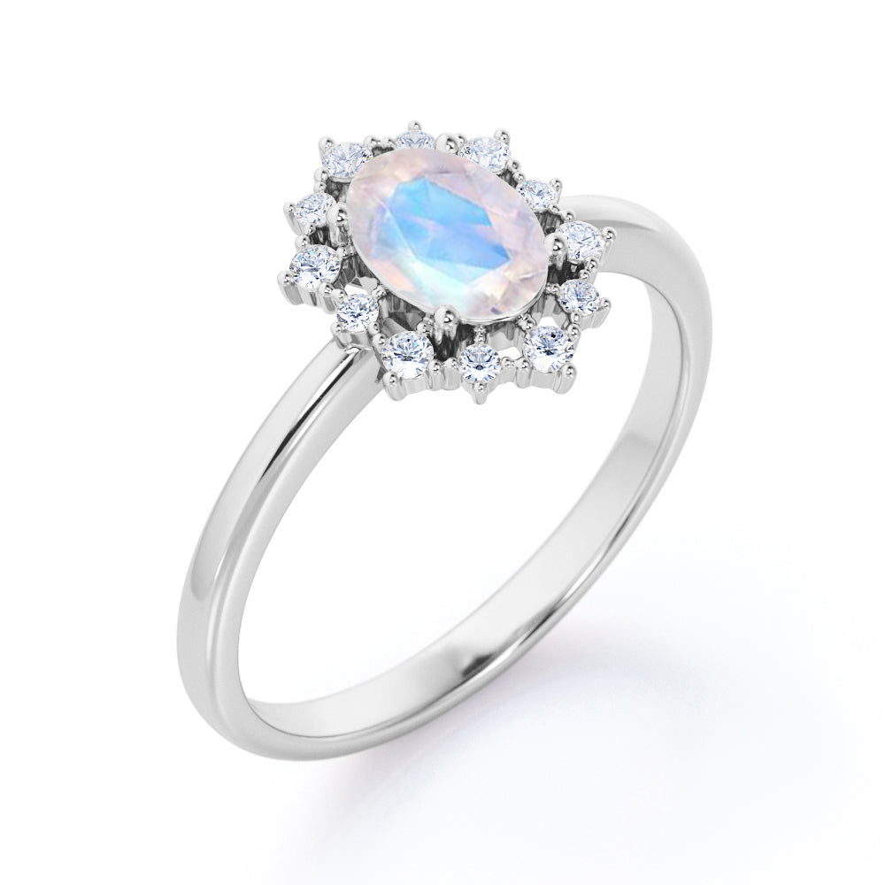 Snowflake inspired 1.25 carat Oval cut Moonstone and diamond unique halo engagement ring in Black gold