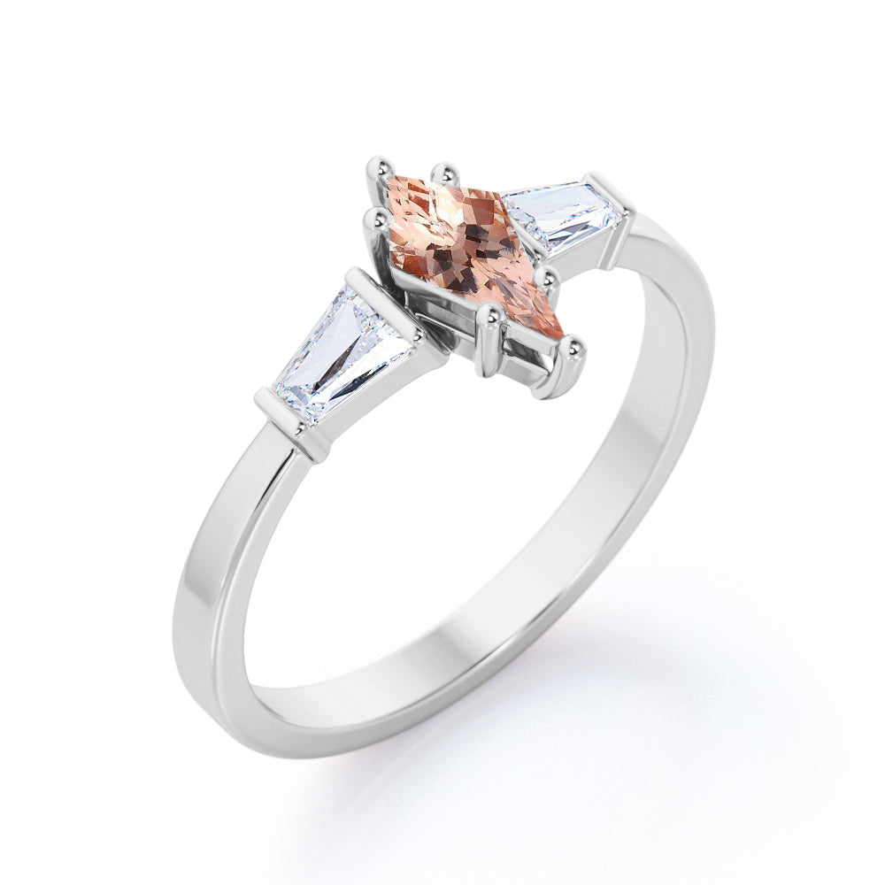 Baguette style 1.1 carat Kite shaped Morganite and diamond three stone anniversary ring in Black gold