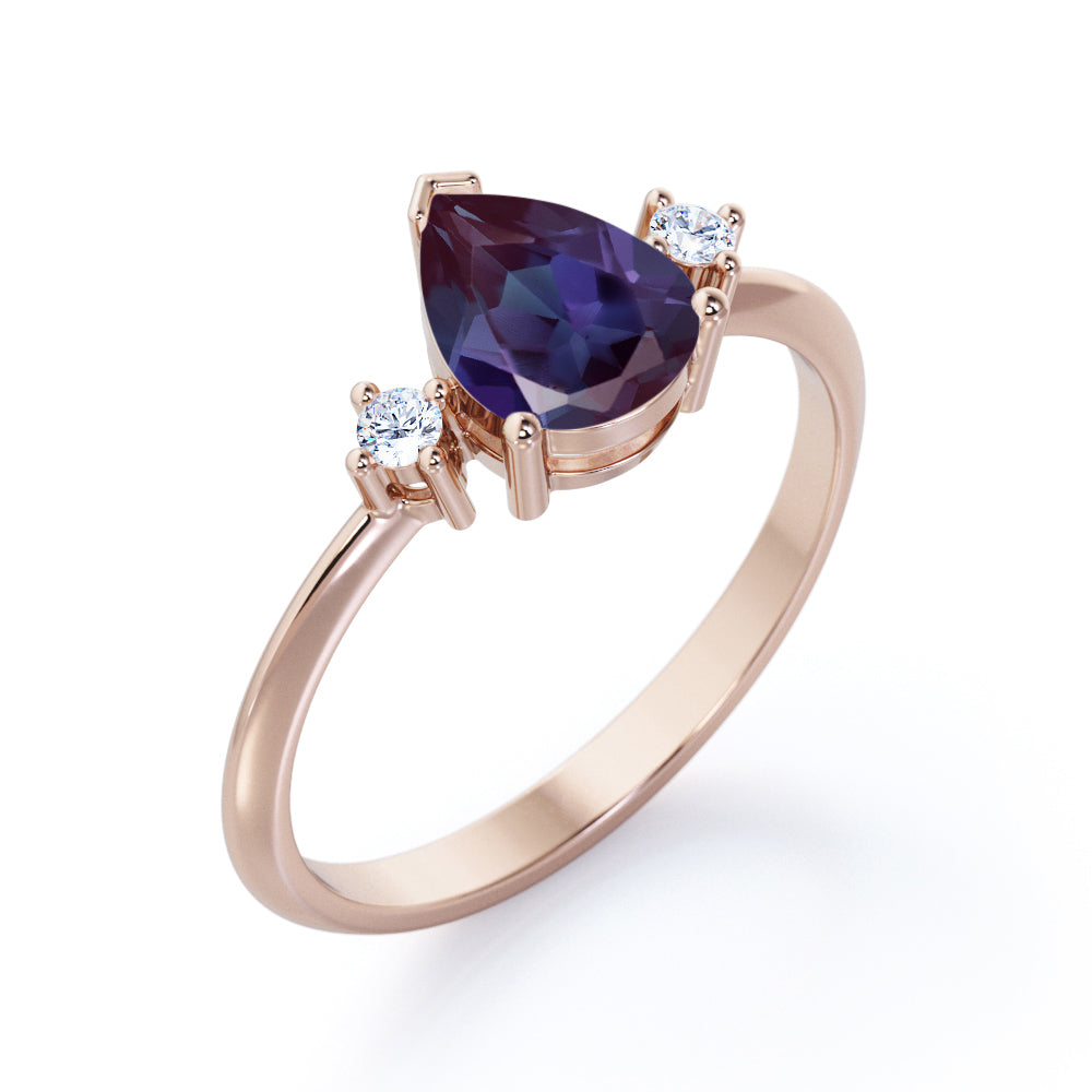 Classic three stone 1.1 carat Pear shaped Alexandrite and diamond pinched shank engagement ring for women in Black gold