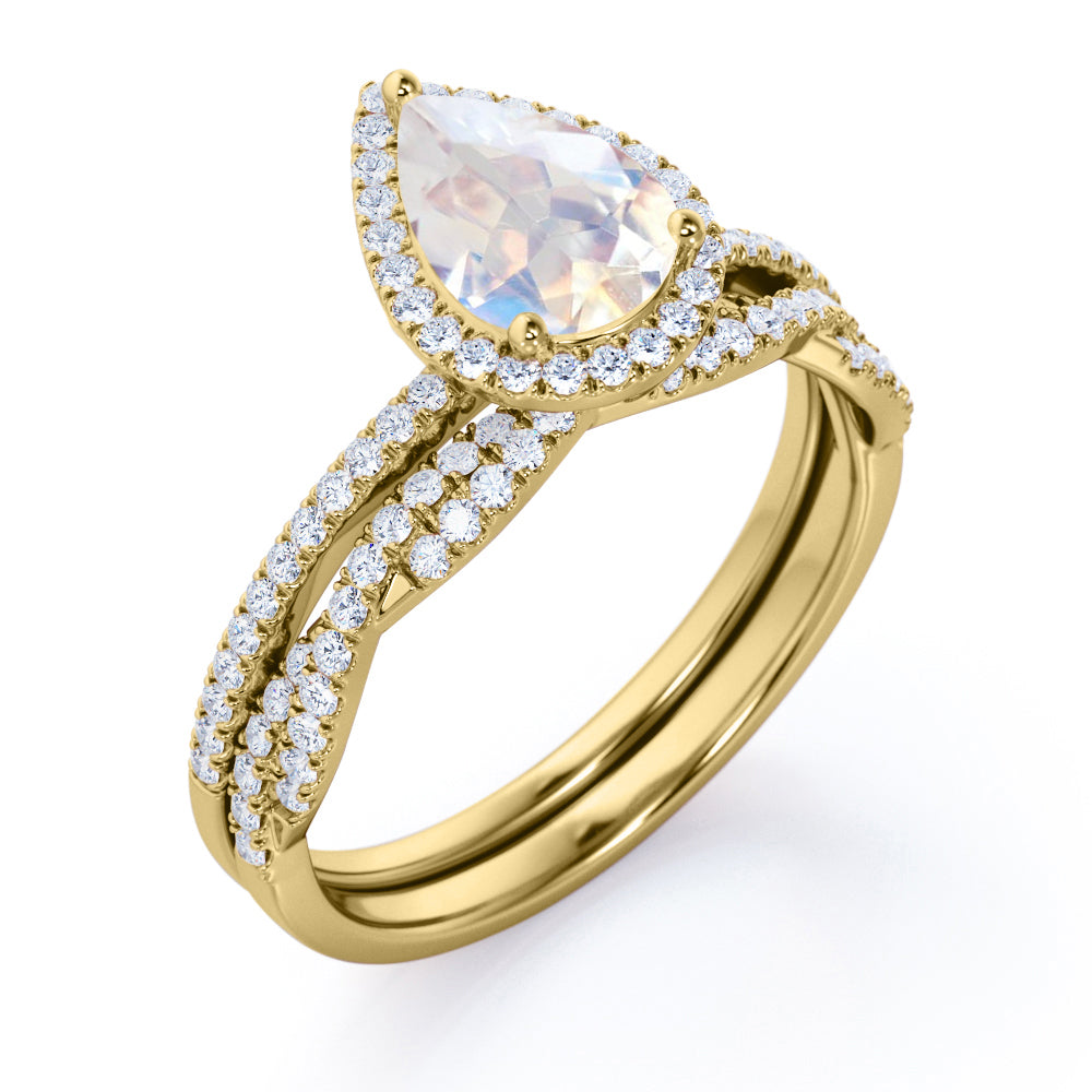 Exquisite 1.75 carat Pear cut Rainbow Moonstone Engagement ring with matching half eternity wedding ring band in gold