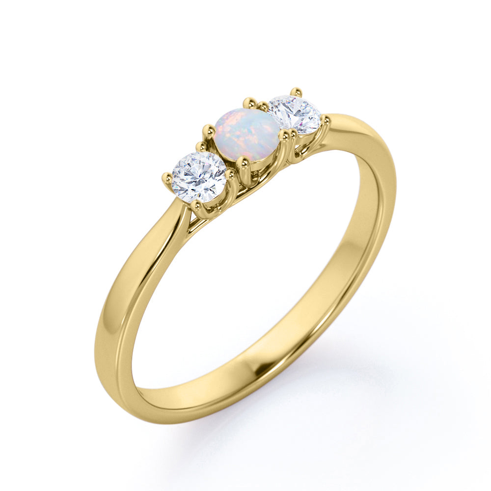 Tapered Shank 0.7 carat Round cut Ethiopian Opal and diamond triple stone engagement ring in Rose gold