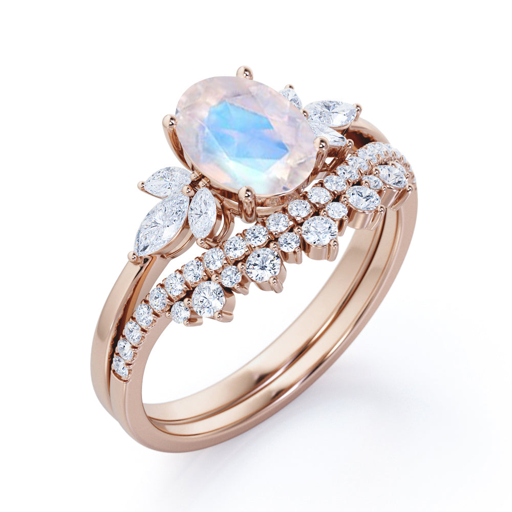 Garland Inspired 1.65 carat Oval shaped Blue Moonstone and diamond contoured seven stone Bridal set in Black gold