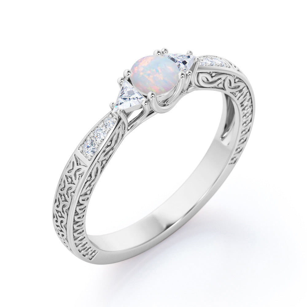Contemporary style Filigree 0.75 carat Round cut Ethiopian Opal and diamond triangle engagement ring for her