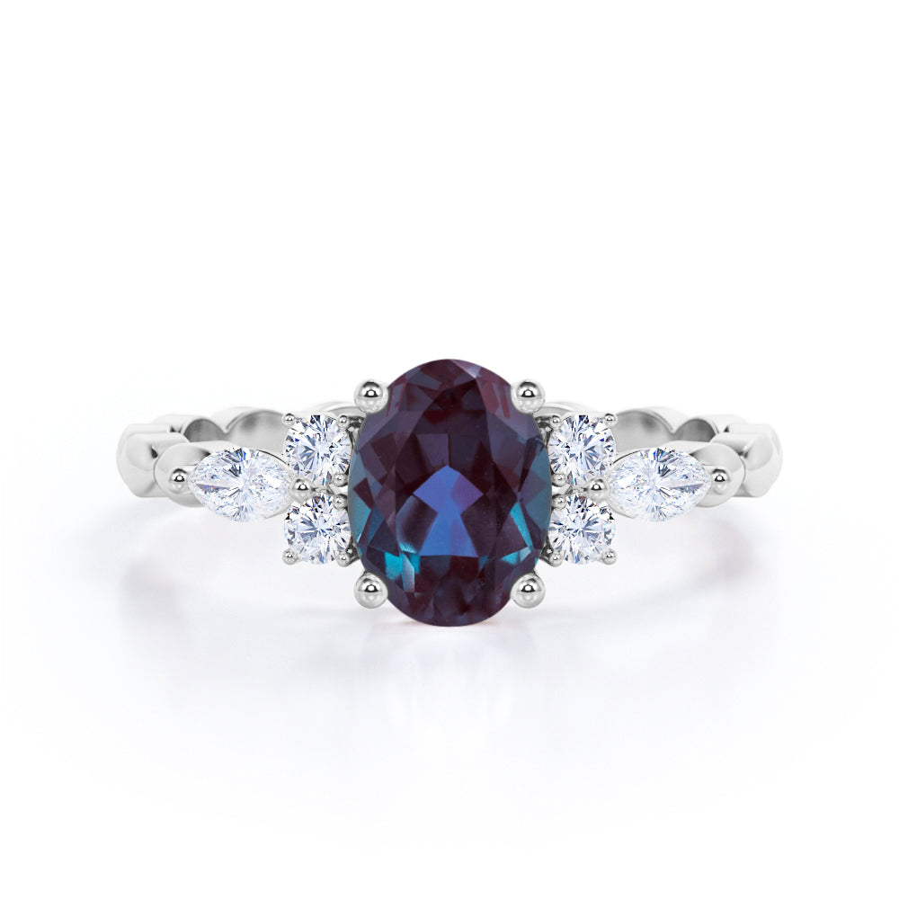 Scalloped bands 1.1 carat Oval cut Lab made Alexandrite and diamond prong style setting engagement ring in White gold