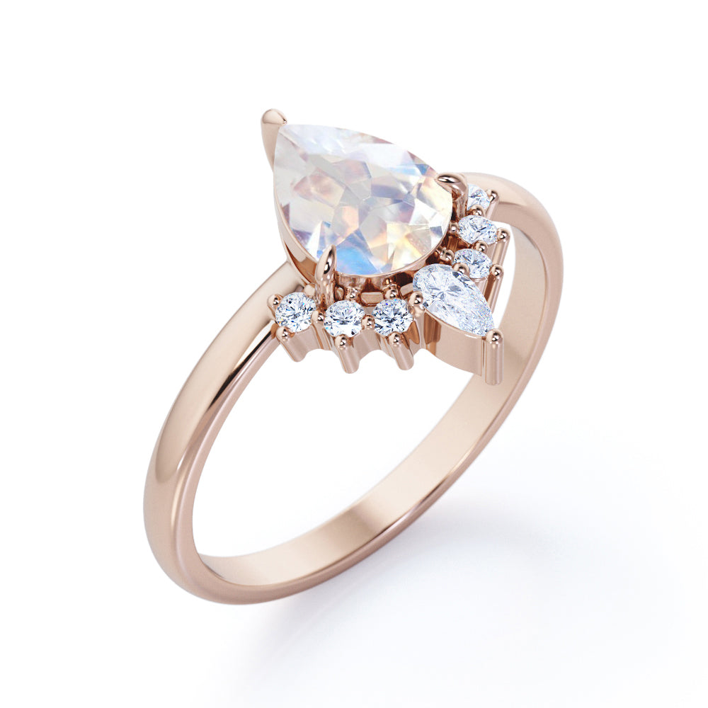 Crown Tiara inspired 1.2 carat Pear cut Rainbow Moonstone and diamond prong style engagement ring in Rose gold