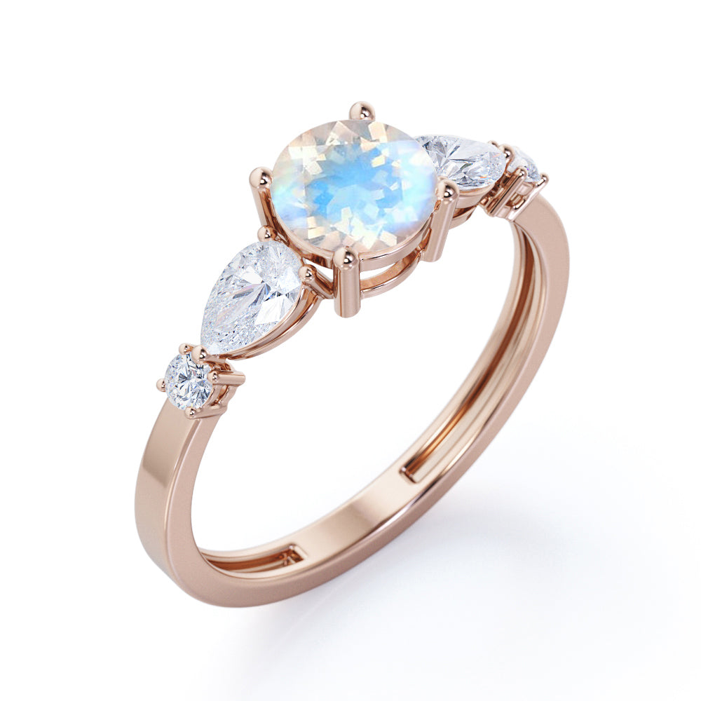 Modern 1.15 carat Round cut Blue Moonstone and diamond marquise 5 stone engagement ring in Rose gold