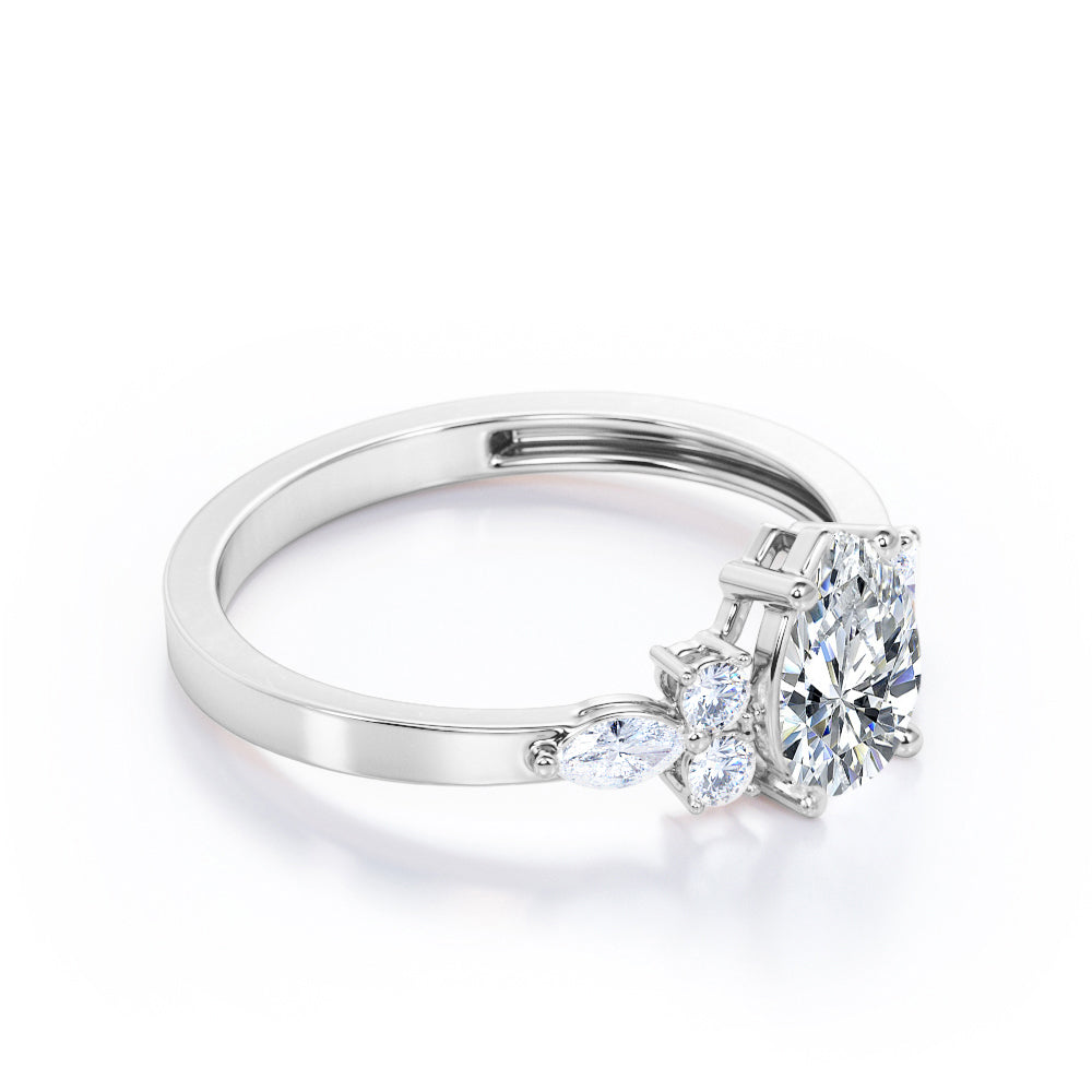 Elegant Beveled Edge 1.15 carat Pear cut Moissanite and diamond engagement ring in White gold