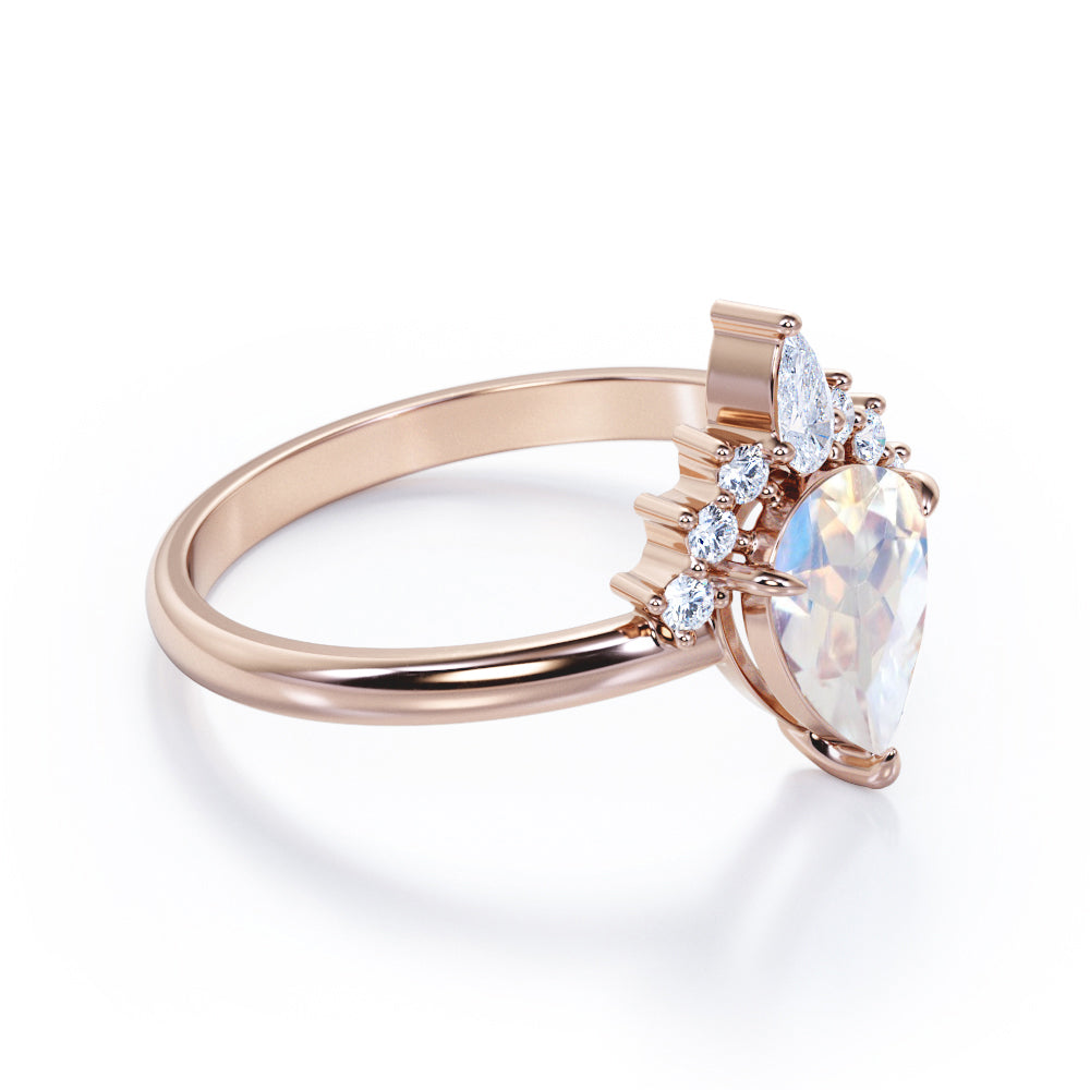 Crown Tiara inspired 1.2 carat Pear cut Rainbow Moonstone and diamond prong style engagement ring in Rose gold