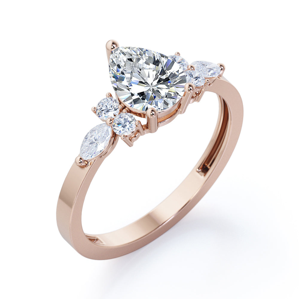Antique 7 stone 1.1 carat Pear Shaped Moissanite and diamond 3 prong engagement ring in Rose gold