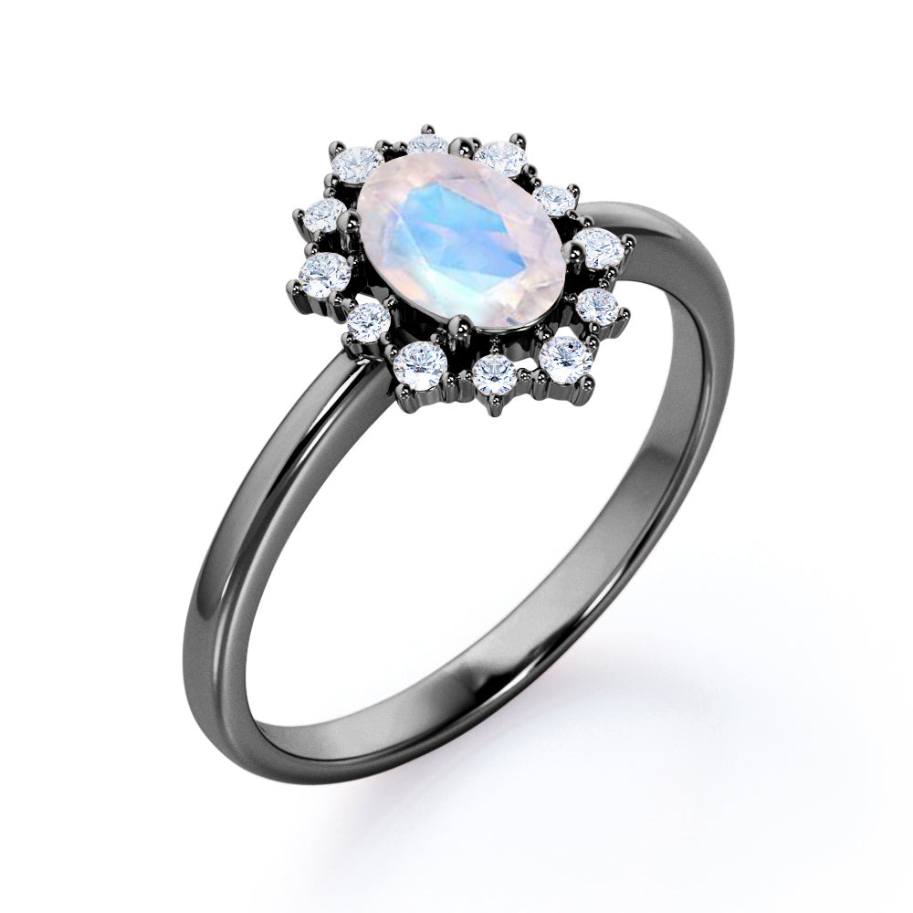 Snowflake inspired 1.25 carat Oval cut Moonstone and diamond unique halo engagement ring in Black gold