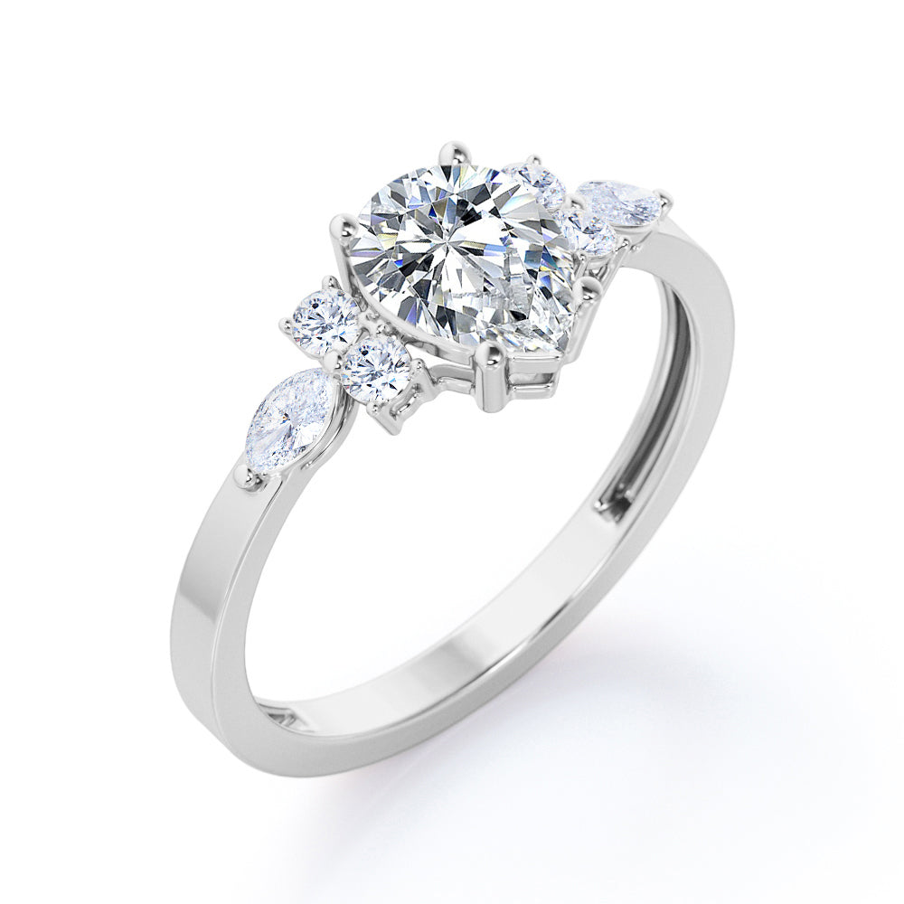 Elegant Beveled Edge 1.15 carat Pear cut Moissanite and diamond engagement ring in White gold