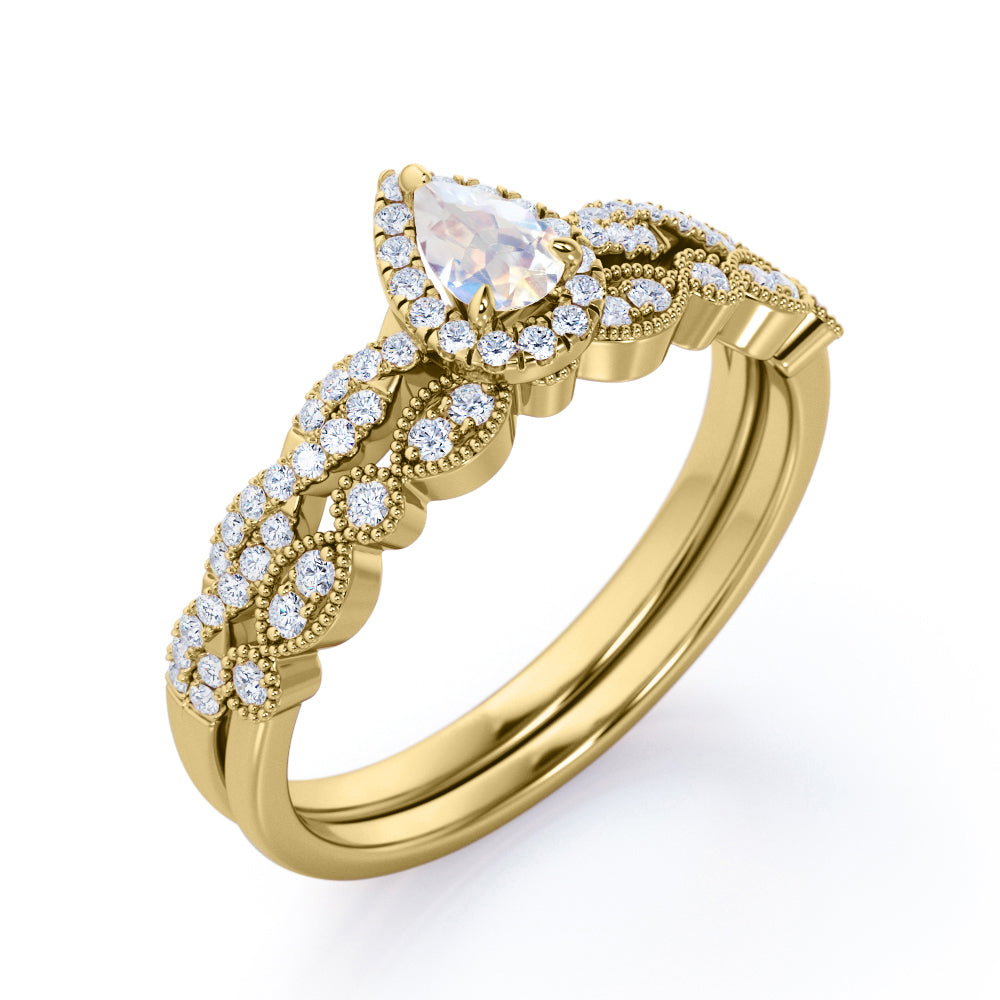 Art deco Milgrain 1.65 carat Pear cut Moonstone and diamond twisted pave engagement ring in yellow gold
