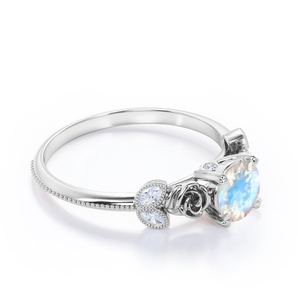 Vintage Rose 1.1 carat Round cut Blue Moonstone and marquise diamond engagement ring in White gold